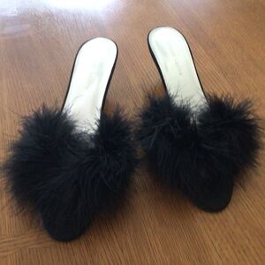 Black Maribou slides, size 9.  Worn for a show but still in great condition.
